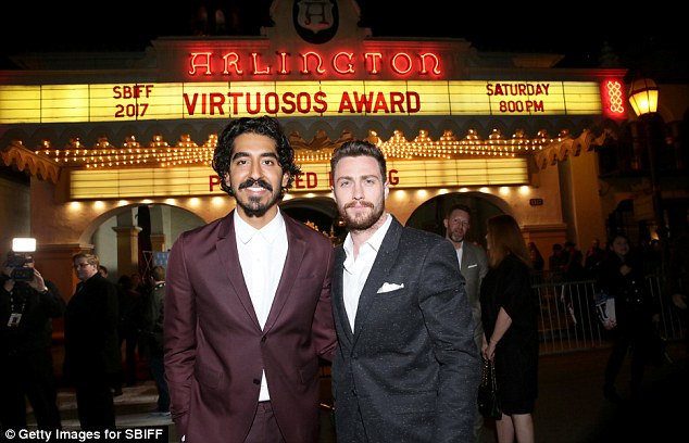 Pals: Oscar nominated actor Dev Patel joined Aaron to receive his honour for his role in Lion
