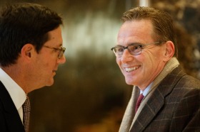 BHP Billiton executives Geoff Healy, left, and Andrew Mackenzie speak in the lobby of Trump Tower in New York.