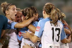 Jessica Fishlock of Melbourne City celebrates scoring the matchwinner with teammates.