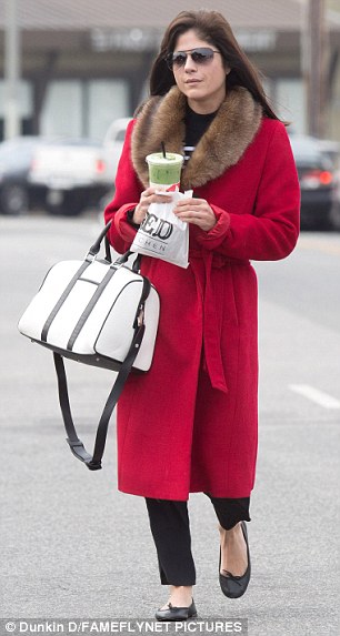 Winter wardrobe: The Ordinary World star had minimalist black ballet flats on foot paired with black trousers that peaked out just a bit under her outerwear