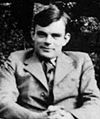 Photograph of Alan Turing, seated
