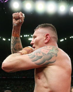 Green celebrates after defeating  Mundine in their cruiserweight bout.