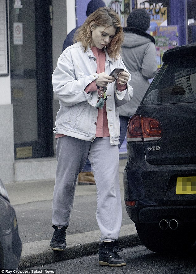 On the telephone: Billie Piper opted to showcase her more low-key wardrobe staples as she was spotted out in North London on Sunday