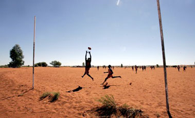 boys playing football