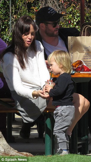 Doting: Taking a hands on approach with Chris and Elsa's two-year-old Tristan, Marta smiled as she oversaw the youngster sip from a plastic cup