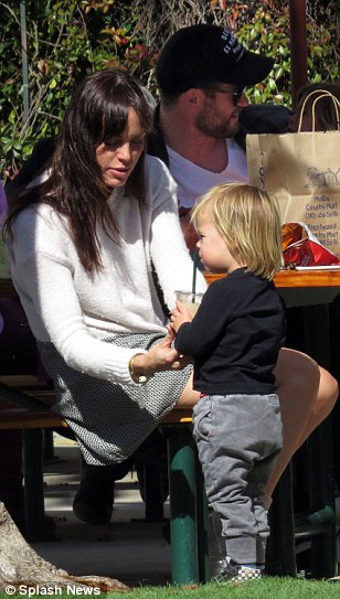 Doting: Taking a hands on approach with Chris and Elsa's two-year-old Tristan, Marta smiled as she oversaw the youngster sip from a plastic cup