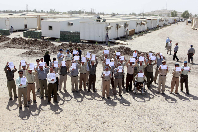 Members of the Mujahedeen-e-Khalq organization chant slogans and hold banners during a tour organized by the Iraqi government for foreign diplomats in Baghdad, Iraq. Elaine Chao, Trump¿s transportation secretary, and former New York Mayor Rudy Giuliani have received payment for speaking before the Mujahedeen-e-Khalq. The group, known by the acronym MEK, killed Americans before Iran¿s 1979 Islamic Revolution and later were supported by Iraqi dictator Saddam Hussein.(AP Photo/Hadi Mizban, File)