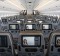 Entertainment monitors sit on the back of passenger seats in the economy class cabin of an Airbus SE A350 aircraft, ...