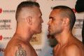 Face off: Danny Green and Anthony Mundine at the weigh-in on Thursday.