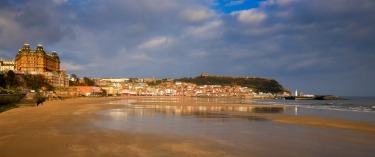 Scarborough, Yorkshire, UK. Jan 2015. Amusement centres, penny slots, Scarborough rock, fishing trawlers and good 'ol ...