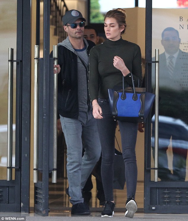 The couple who shop together: The TV and radio celebrity gallantly held the door for Shayna when they checked out Barneys New York in Beverly Hills last month