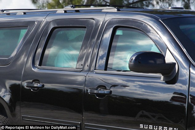 His low-key Sunday morning came after a glitzy Saturday night at the Red Cross Gala and amid ongoing legal strife over his controversial travel ban. He is pictured above in his motorcade