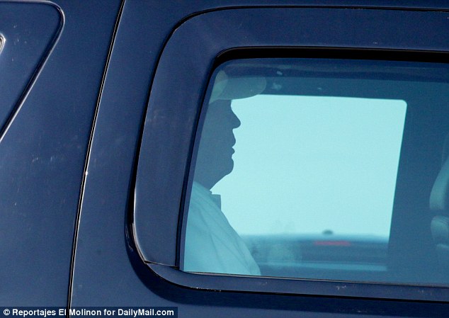 The president was spotted leaving Trump International Golf Club in West Palm Beach to take him back to his Mar-a-Lago retreat, which was being circled by the coast guard. He is pictured above in his motorcade