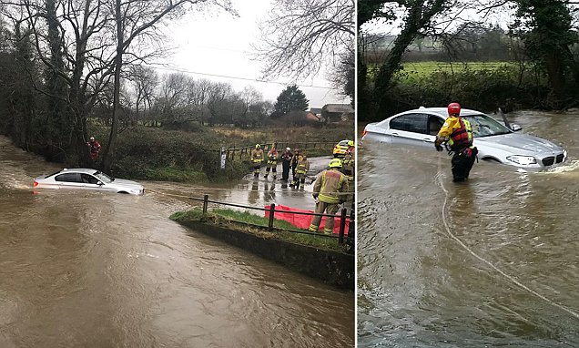 BMW driver rescued after getting trapped in RIVER 