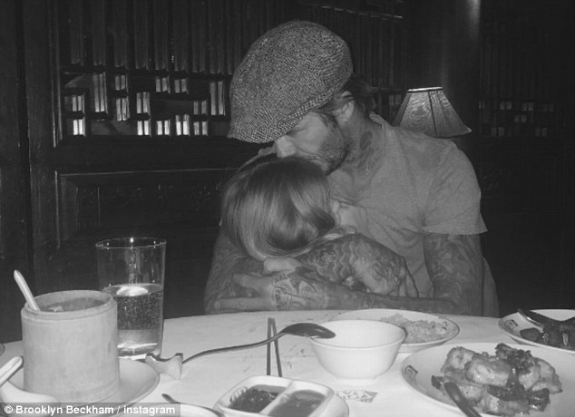 David Beckham's eldest son Brooklyn posted a picture of his father cuddling his young sister Harper in a touching photograph posted on Instagram