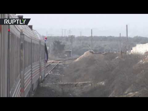 Syrians seen smiling and excited as train travels through Aleppo for first time in over four years