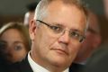 Treasurer Scott Morrison listens as Prime Minister Malcolm Turnbull addresses the National Press Club of Australia in ...