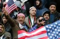 Muslims and Yemenis gather with their supporters on the steps of Brooklyn's Borough Hall, during a protest against ...