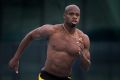 All Star: Former world record-holder Asafa Powell training at Albert Park on Wednesday.