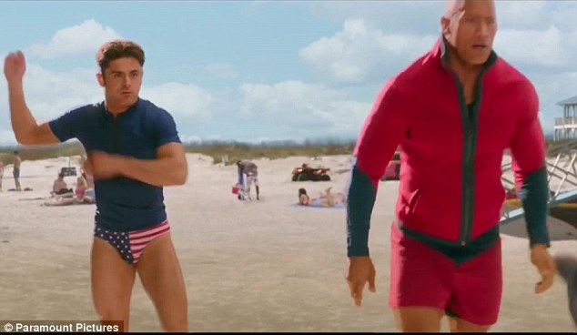 Flying the flag: Zac Efron took his own brand of nationalism a bit too far... at least for his co-star Dwayne 'The Rock' Johnson in the new trailer for Baywatch