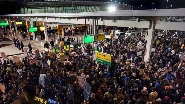 Protesters assemble at John F. Kennedy International Airport in New York, after earlier in the day two Iraqi refugees ...