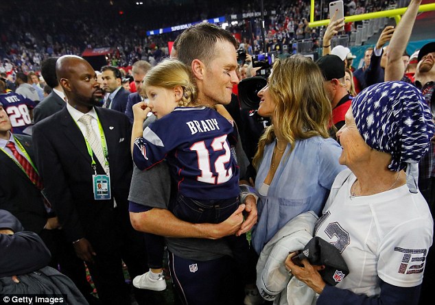 Loved up: Shortly after the celebration in the box, Gisele and the family hit the field to congratulate the star quarterback personally