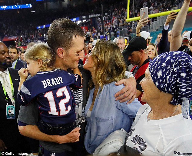 Altogether now: Gisele came in for a kiss during the celebration