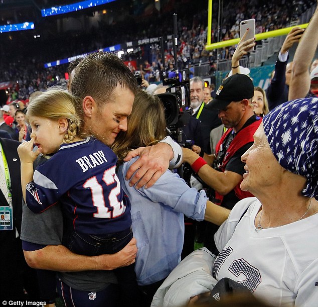 Daddy did it! Tom proudly carried his four-year-old daughter Vivian as she picked her nose