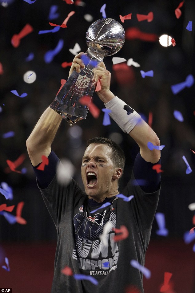 Greatest of all-time: Tom proudly held up the Vince Lombardi Trophy as he won the championship for the fifth time and Super Bowl MVP for a fourth