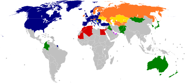 A world map with countries in blue, cyan, orange, yellow, purple, and green, based on their NATO affiliation.