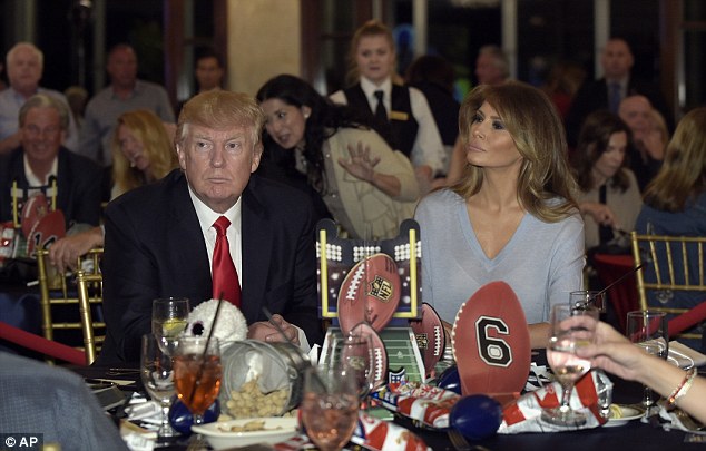 Bennett had previously said he might not go on the celebratory trip because he doesn't 'support the guy that's in the house'. Trump is pictured Sunday watching the game