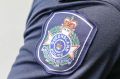 The man allegedly spat and bit two police officers on the Sunshine Coast.
