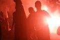 A flare is lit at the Melbourne derby on Saturday night.