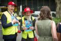 Minister for Housing Martin Foley with Big Issue vendor Russell (right) sells the latest issue to mark the beginning of ...