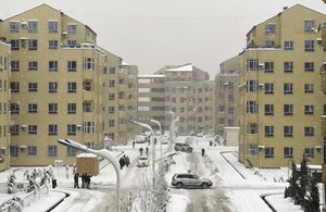 Residences walk during snow fall in Kabul, Afghanistan