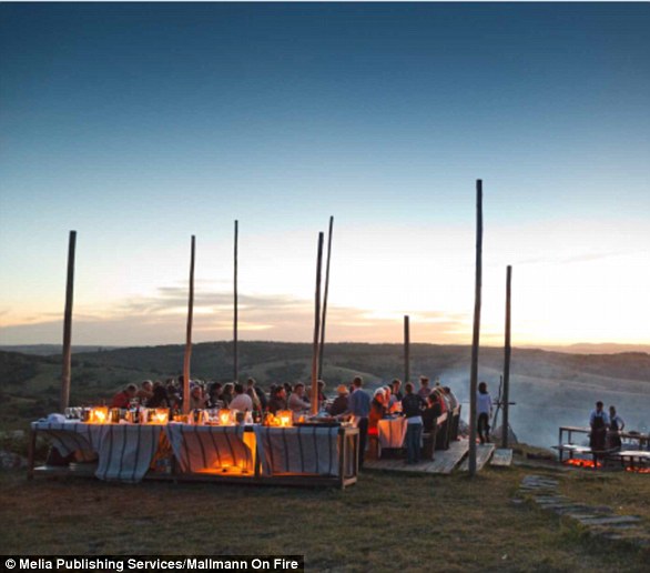 In Mallmann's book, Mallmann on Fire, the chef cooks in remote parts of the world on open fires, such as a mountain top (pictured)