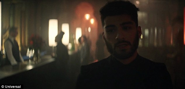 The walk: Zayn lip-syncs the first verse, which sees him slide into his querulous falsetto, as he strolls through the St Pancras Renaissance London hotel's lobby, a paparazzo in pursuit
