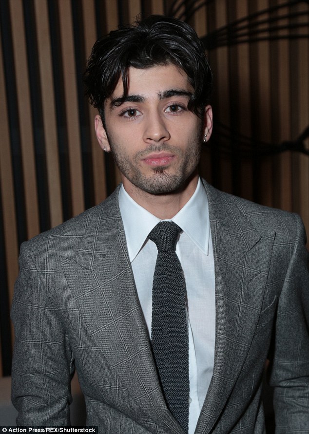 Casually cool: Zayn Malik appears to be preferring his longer and messier 'do as he maintained the style at the Fifty Shades Darker premiere on Thursday night