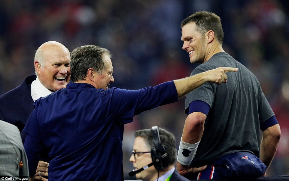 Who's the man: Terry Bradshaw looks on at Belichick and Brady as they celebrate passing his record of four Super Bowl wins