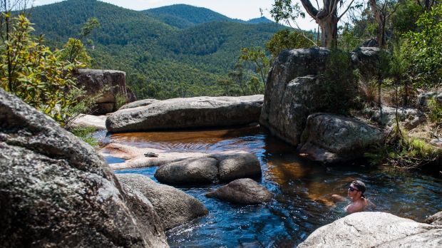 Luke Clarke of Calwell cools off in the rock pools at Gibraltar Falls during hot weather.