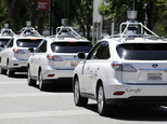 FILE - This May 13, 2014, file photo shows a row of Google self-driving Lexus cars at a Google event outside the Computer History Museum in Mountain View, Calif. California regulators release safety reports filed by 11 companies that have been testing self-driving car prototypes on public roads on Wednesday, Feb. 1, 2017. The papers report the number of times in 2016 that human backup drivers took control from the cars' self-driving software, though companies argue such "disengagements" don't always reflect something going wrong. (AP Photo/Eric Risberg, File)