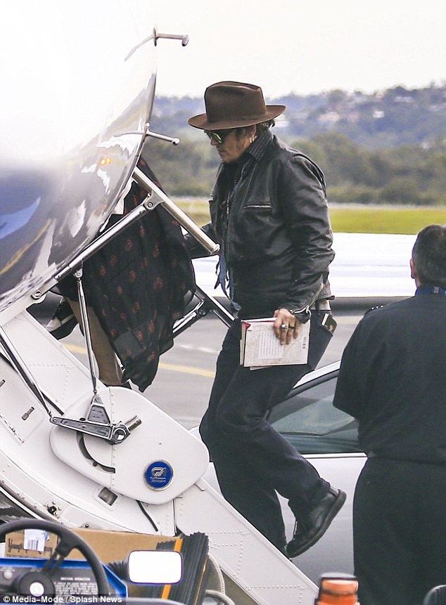 Jetting off in style! Johnny recently accused The Management Group (TMG) of defrauding him out of tens of millions of dollars; he is seen on a private jet in this file picture