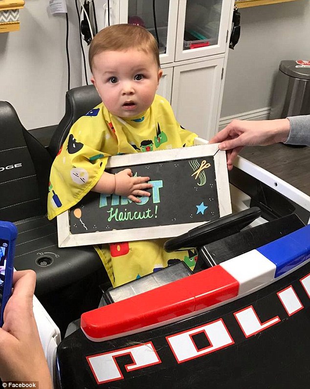 Major milestone: Katherine Webb and her husband, football star AJ McCarron, celebrated their eight-month-old son Tripp's first haircut on Thursday 