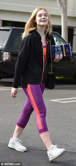 Beaming: The teen proved her sartorial chops extended to loungewear too as she paraded her svelte figure in matching neon co-ords