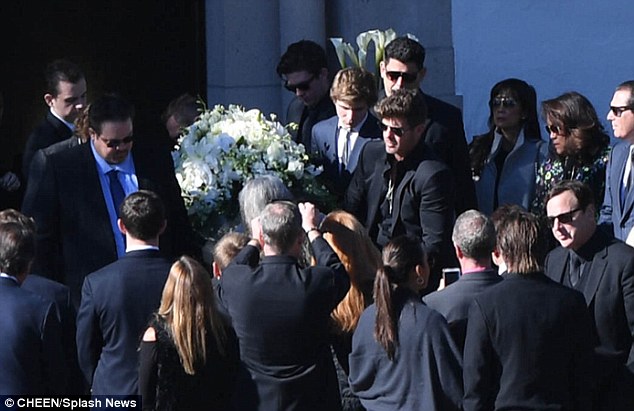 'That was really rough': Carter's said that ''Being one of the pallbearers of the casket, that’s – that was – that was brutal'; he is pictured alongside the coffin with his elder brothers Robin and Brennan Thicke