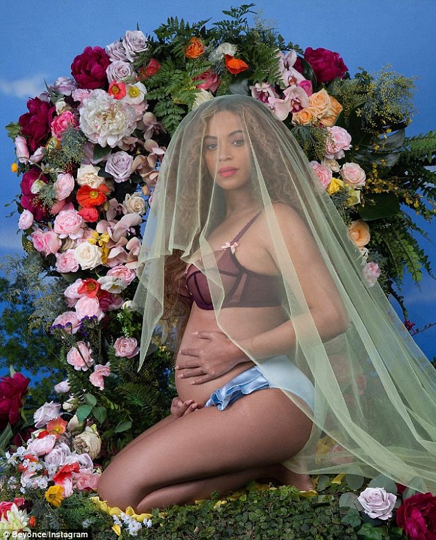 Glowing goddess: Beyonce surprised fans after she posted a picture of her growing baby bump to her Instagram