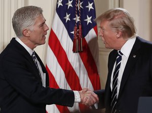 President Donald Trump shakes hands with Judge Neil Gorsuch in East Room of the White House in Washington, Tuesday, Jan. 31, 2017, as he announces Grouch as his nominee for the Supreme Court.