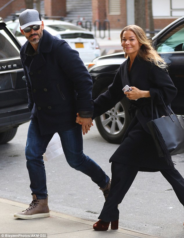 High spirits: LeAnn Rimes cut a stylish figure when she was spotted in New York City, holding hands with her husband Eddie CIbrian