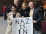 In this photo provided by Eric Martinez, Nazanin Zinouri, front left, and her colleagues from Modjoul, a startup technology firm in Clemson, S.C., pose for a photo after Zinouri arrived at Logan International Airport in Boston on Sunday, Feb. 5, 2017. Zinouri, an Iranian engineer who had been blocked from returning to South Carolina by President Donald Trump's travel ban against seven Muslim nations, returned to the U.S. on Sunday. Modjoul founder Martinez, from left, co-worker Jen Thorson and Rick Toller stand by Zinouri. (courtesy of Eric Martinez via AP)