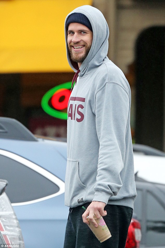 Surfer dude: Liam Hemsworth went to the beach in Malibu, California on Friday